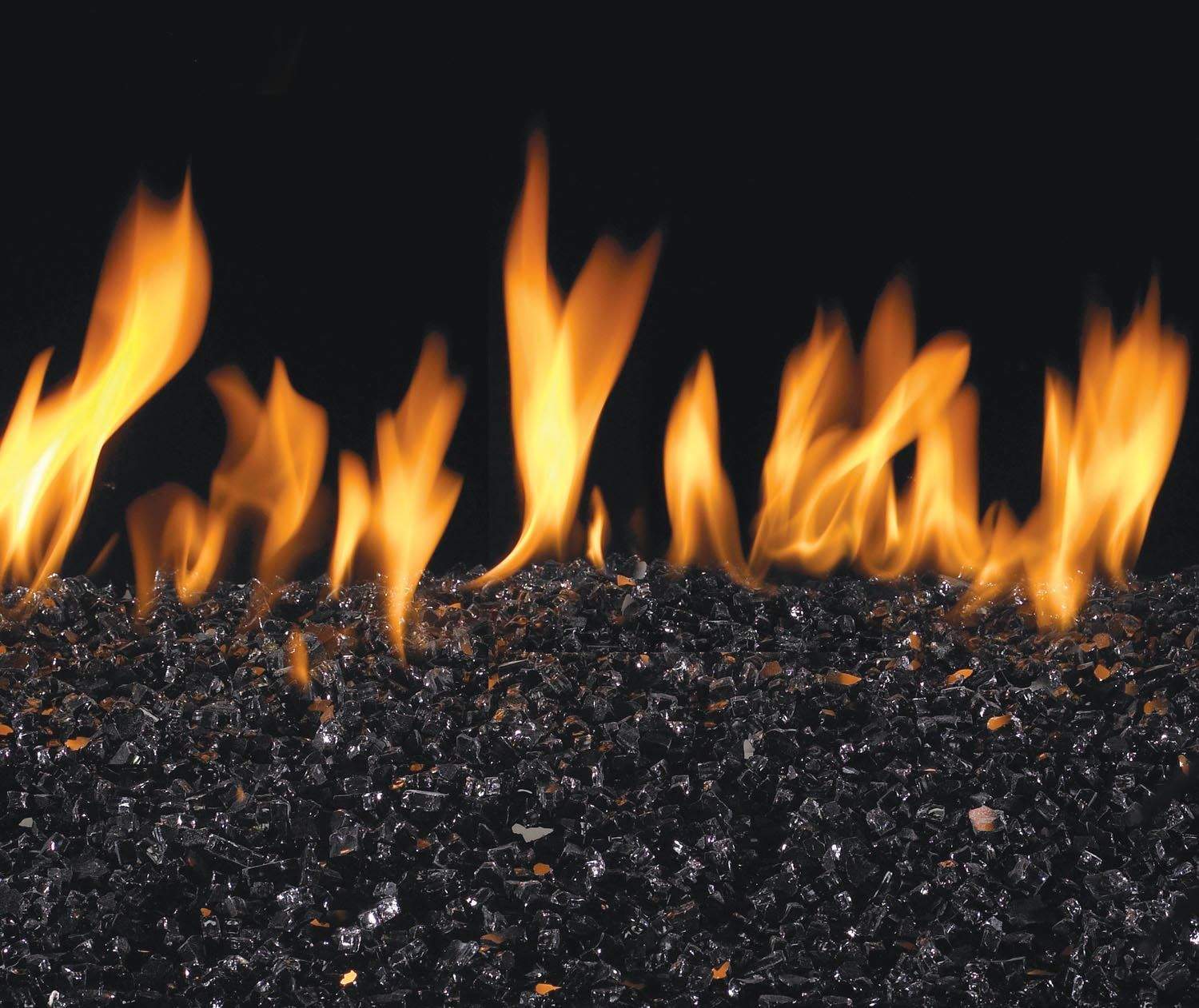Vented gas burner flames over dark black glass and gravel media
