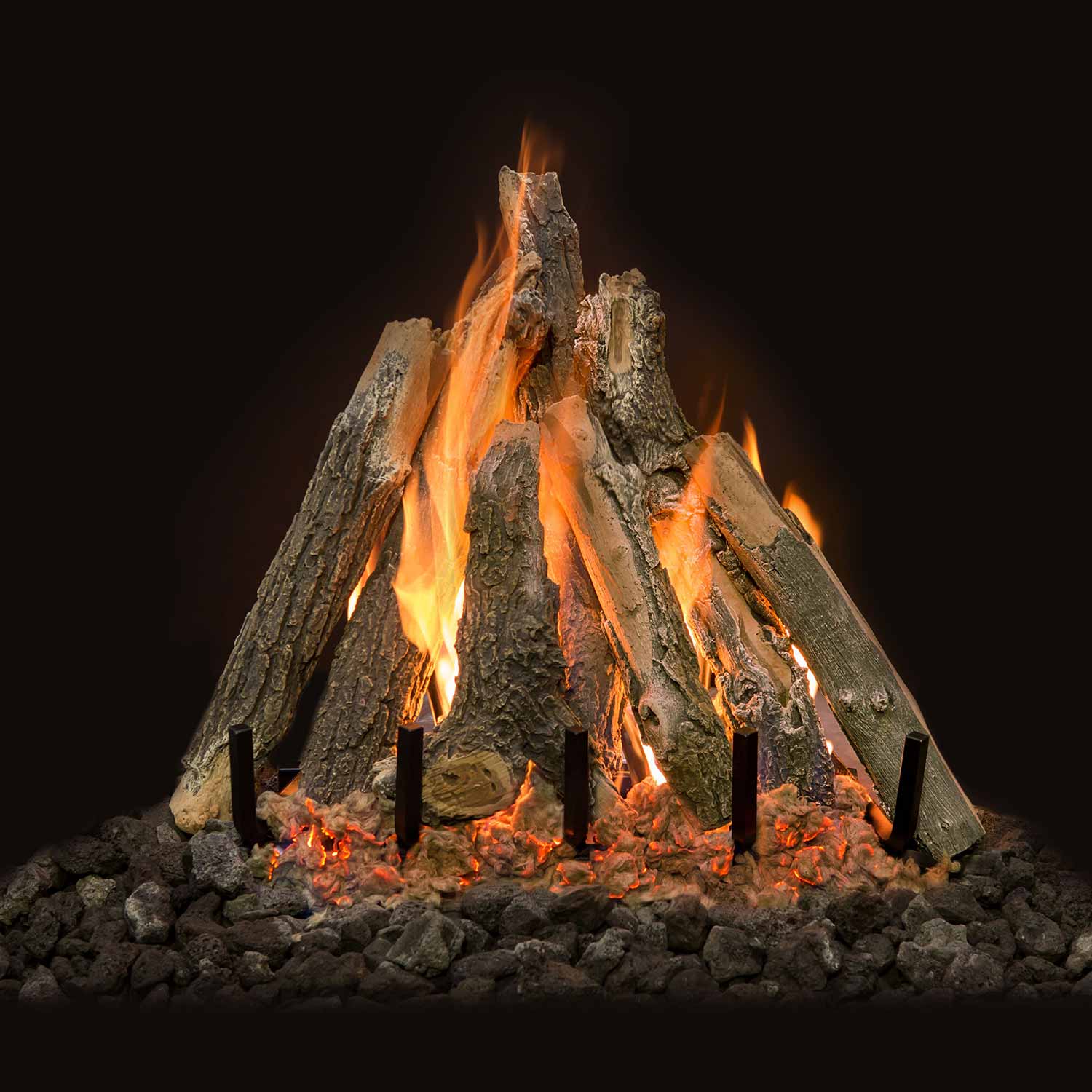 Weathered oak gas fire logs with visible flames and glowing embers