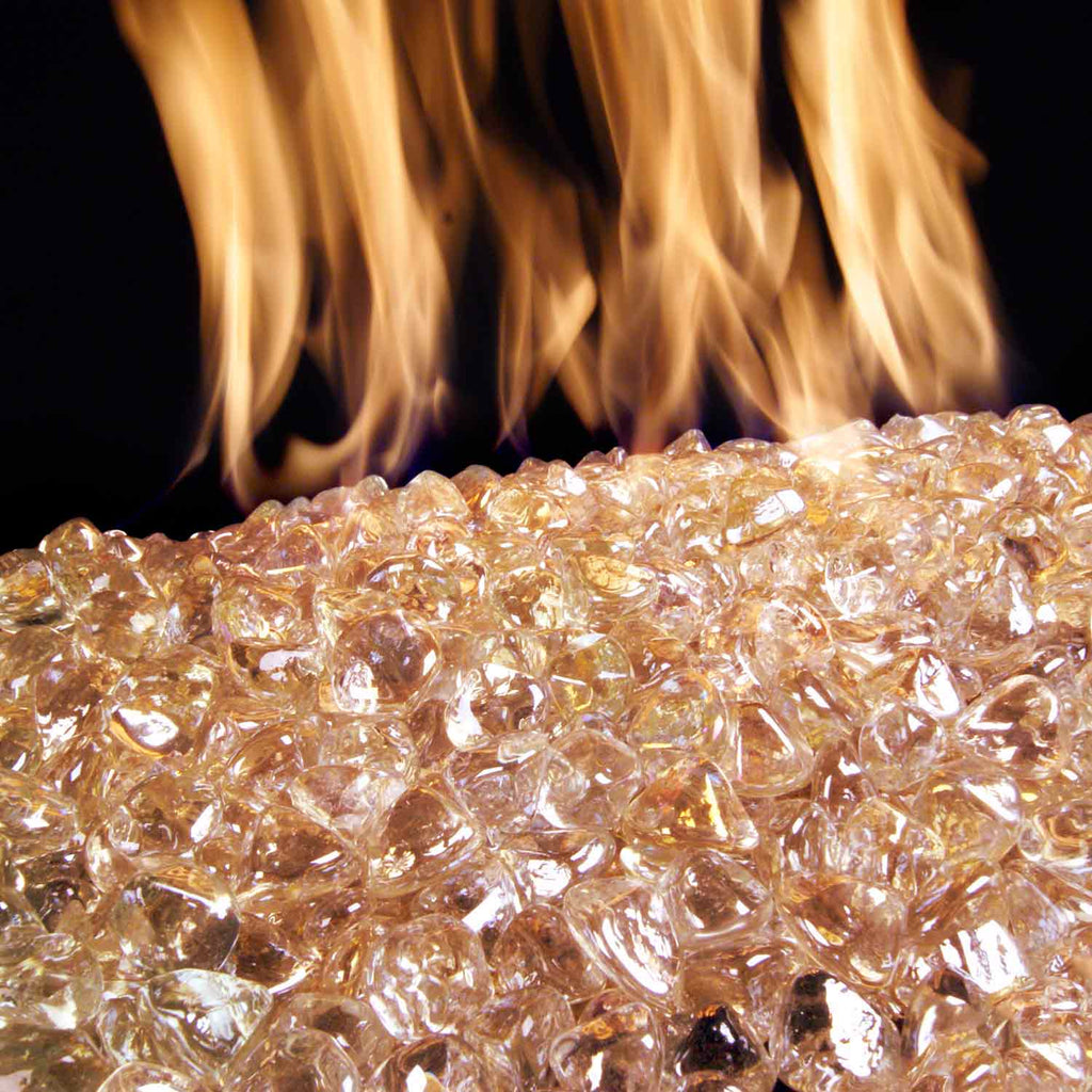 Rose diamond fire pit nuggets with flame glow, translucent orange-pink glass