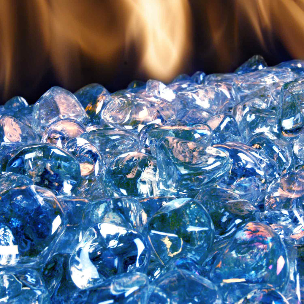 Steel blue glass diamond nuggets piled together, glossy faceted stones