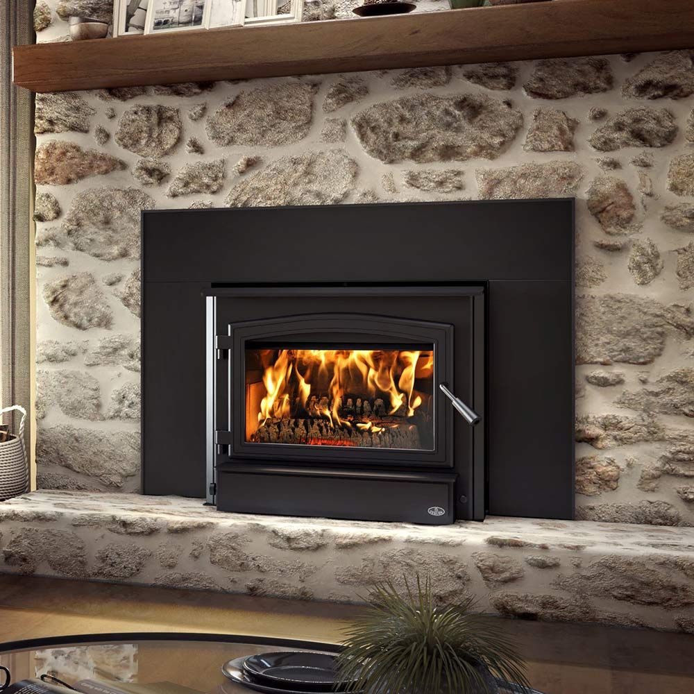 Black wood-burning fireplace insert with glass door, burning flames, metal handle