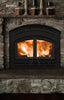 Classic wood-burning fireplace with roaring flames