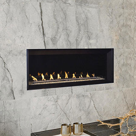Linear vent-free gas fireplace with burning logs, black surround